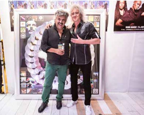 Con Brian May, durante uno dei tour più recenti dei rimanenti Queen.